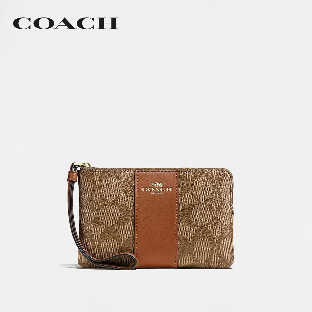 COACH กระเป๋าคล้องมือขนาดเล็กผู้หญิง รุ่น Corner Zip Wristlet In Signature Canvas สีครีม 58035 IME74 1fb602726d0a194d16573a5f3d219b83