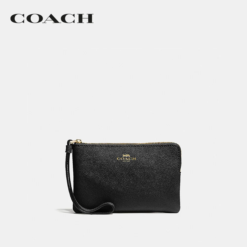COACH กระเป๋าคล้องมือขนาดเล็กผู้หญิง รุ่น Corner Zip Wristlet สีดำ 58032 IMBLK e47fd0c7fa5727c99bc00a549584329e