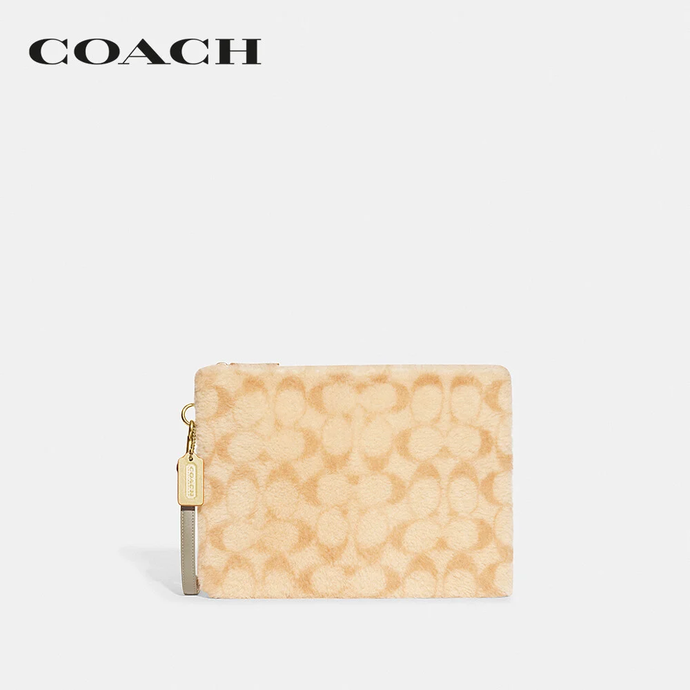COACH กระเป๋าถือ ผู้ชาย รุ่น Charter Pouch In Signature Shearling สีครีม CC157 UPZ 3d2098c002116cc685ec7b2255cb2407